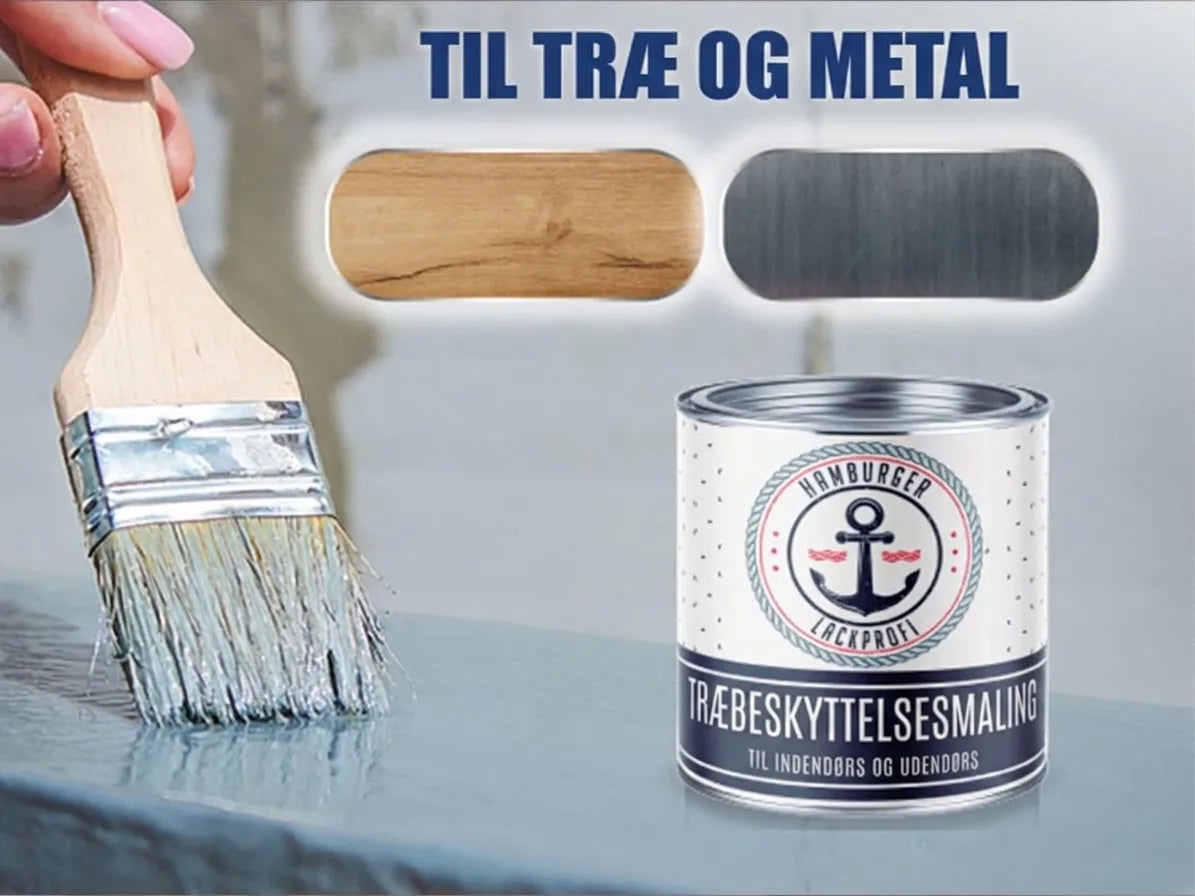 Pensel påfører træbeskyttelsesmaling til træ og metal. Dåse med ankerlogo fra Hamburger Lackprofi.